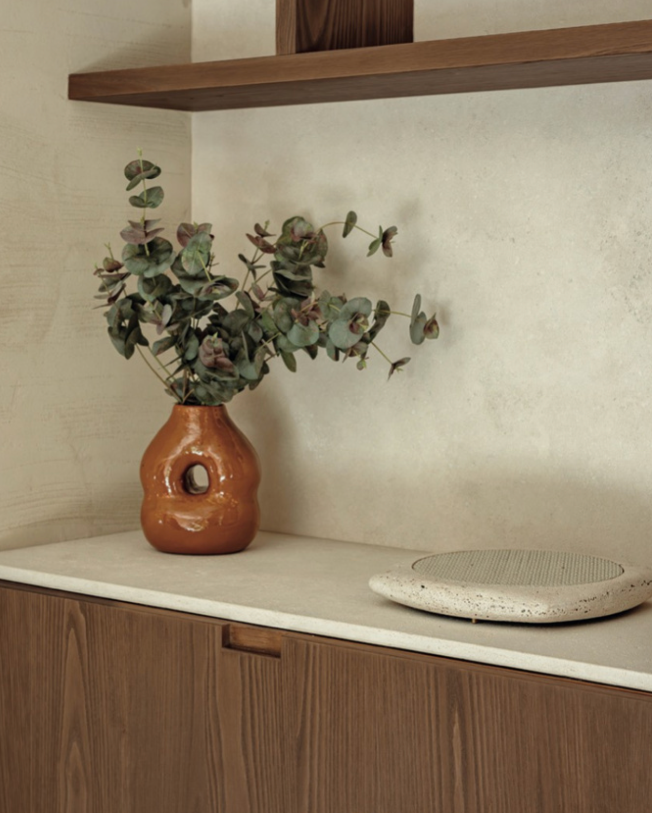 Beige stone wireless phone charger in kitchen 