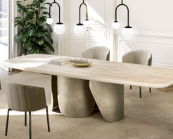 Modern dining room with a large wooden table and chairs, featuring pendant lights and a plant.