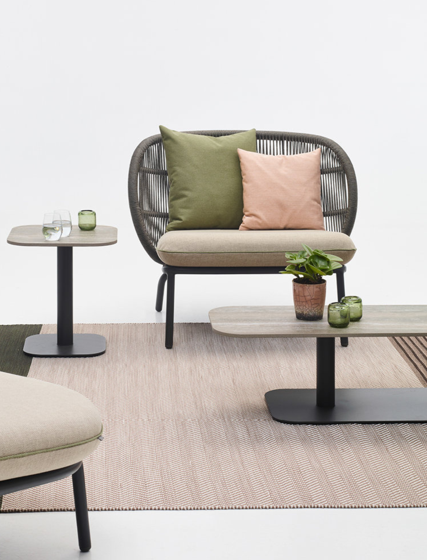 Kodo Lounge Chair in setting with tables and rug